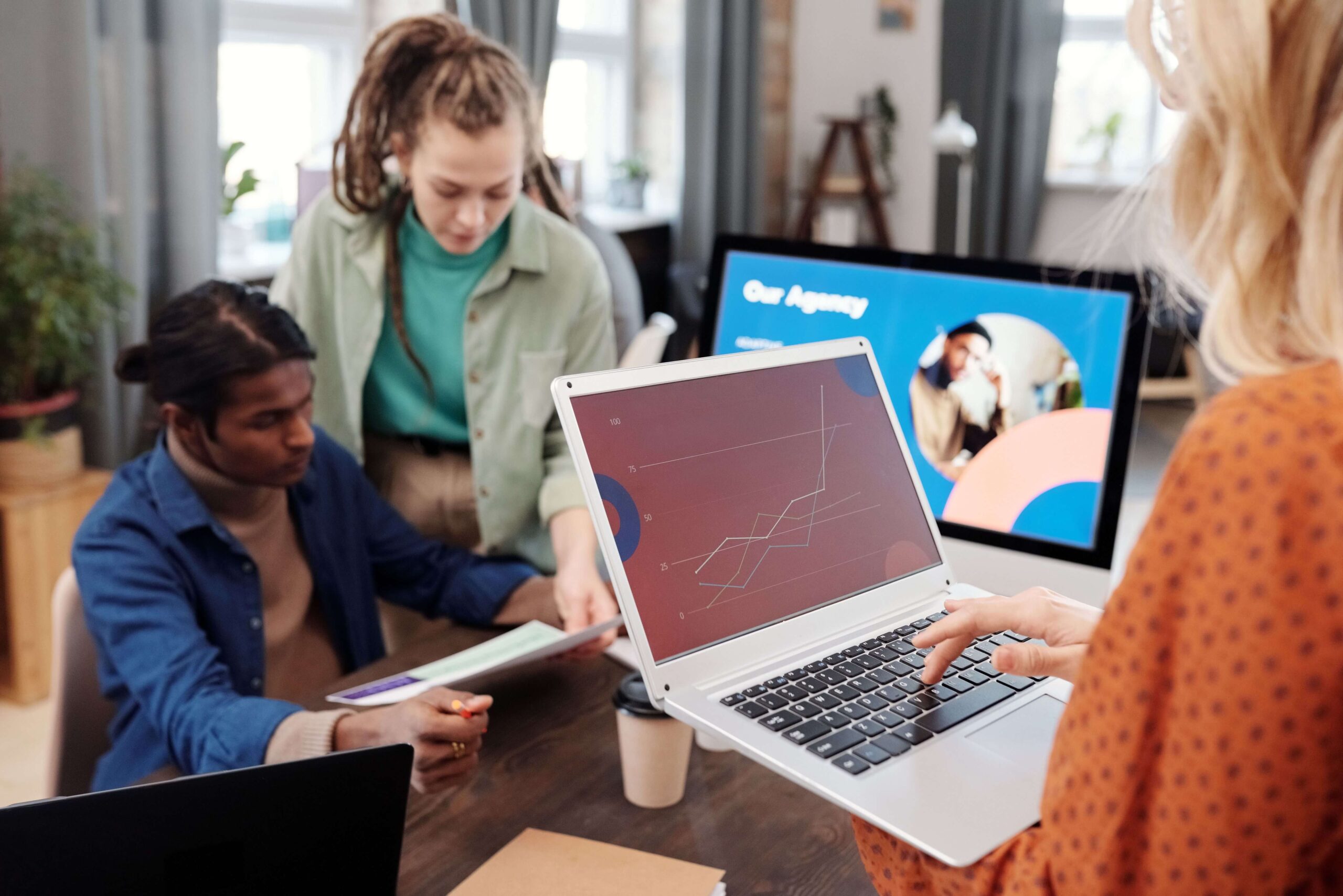 a team of people work in office